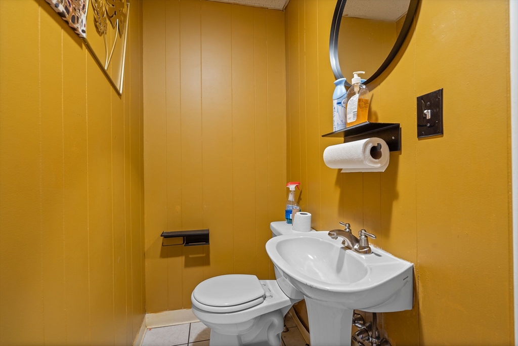 84 Cory Street Fall River, MA 02720 - Photo 9 of 36 a bathroom with a sink and a toilet