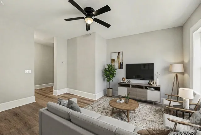 a living room with furniture and a flat screen tv