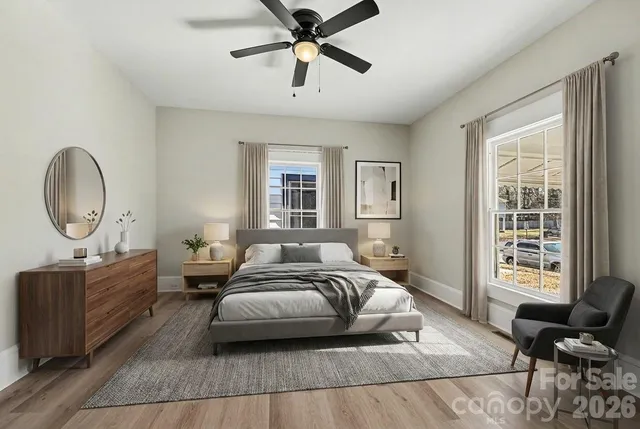 a bedroom with a bed a couch and dresser