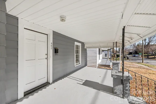 a view of a living room and balcony