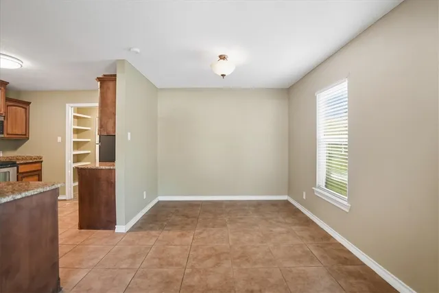 a view of hallway with windows