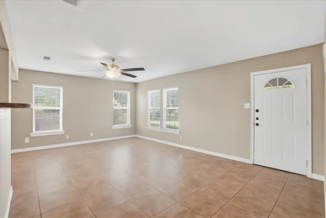 a view of an empty room with a window