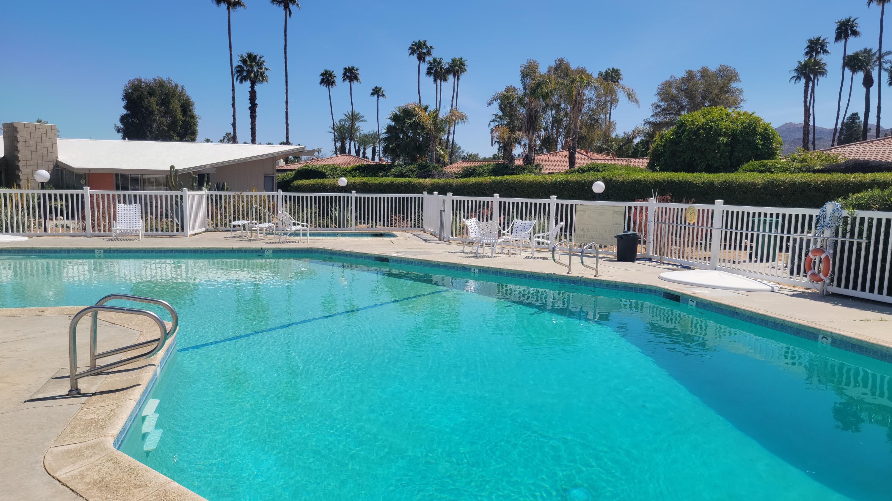 a view of a swimming pool with a deck