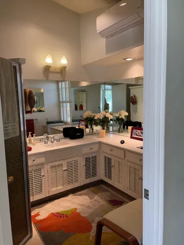 a kitchen with stainless steel appliances granite countertop a sink and cabinets