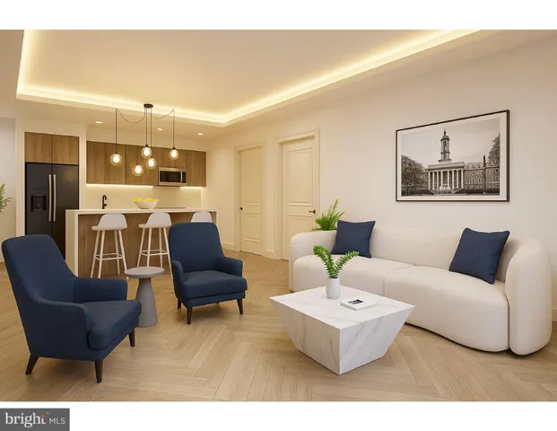 a living room with furniture and chandelier