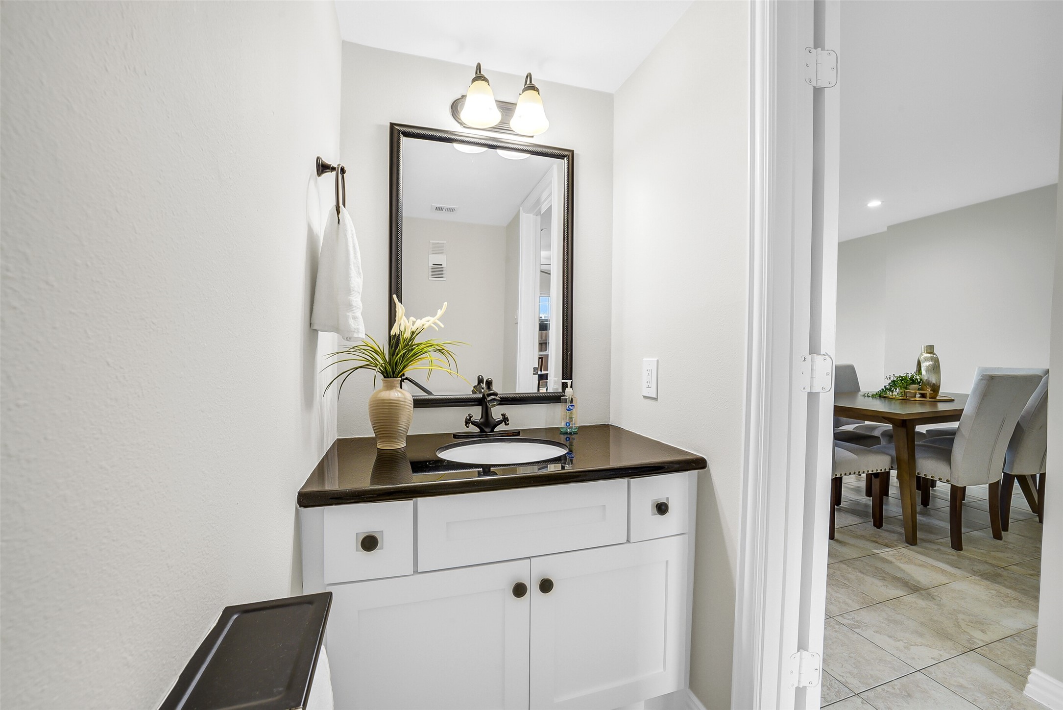 6531 Wanda Lane Houston, TX 77074 - Photo 14 of 29 a bathroom with a granite countertop sink and a mirror