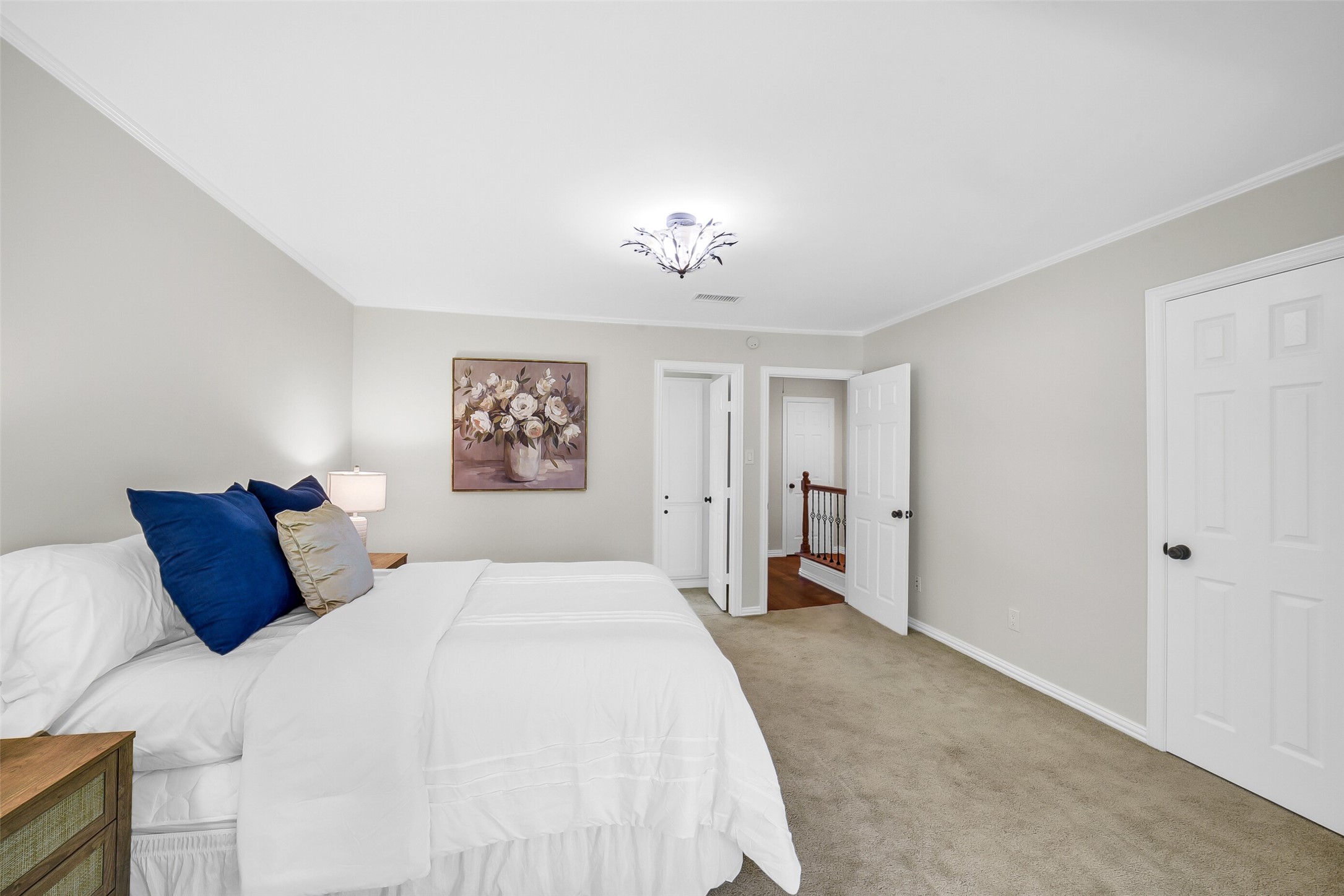 6531 Wanda Lane Houston, TX 77074 - Photo 15 of 29 a bedroom with a bed and a chandelier