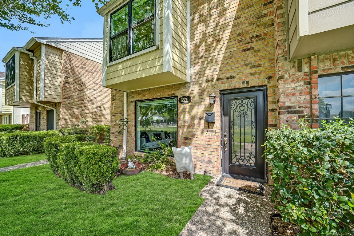 6531 Wanda Lane Houston, TX 77074 - Photo 4 of 29 front view of a brick house with a yard
