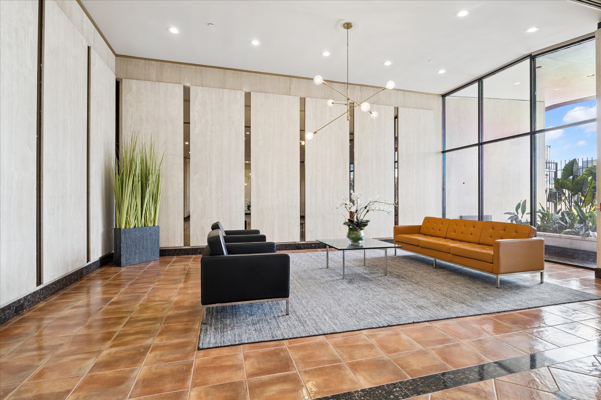 2016 Main Street, Unit 2417 Houston, TX 77002 - Photo 14 of 40 a spacious bedroom with a large window and a rug