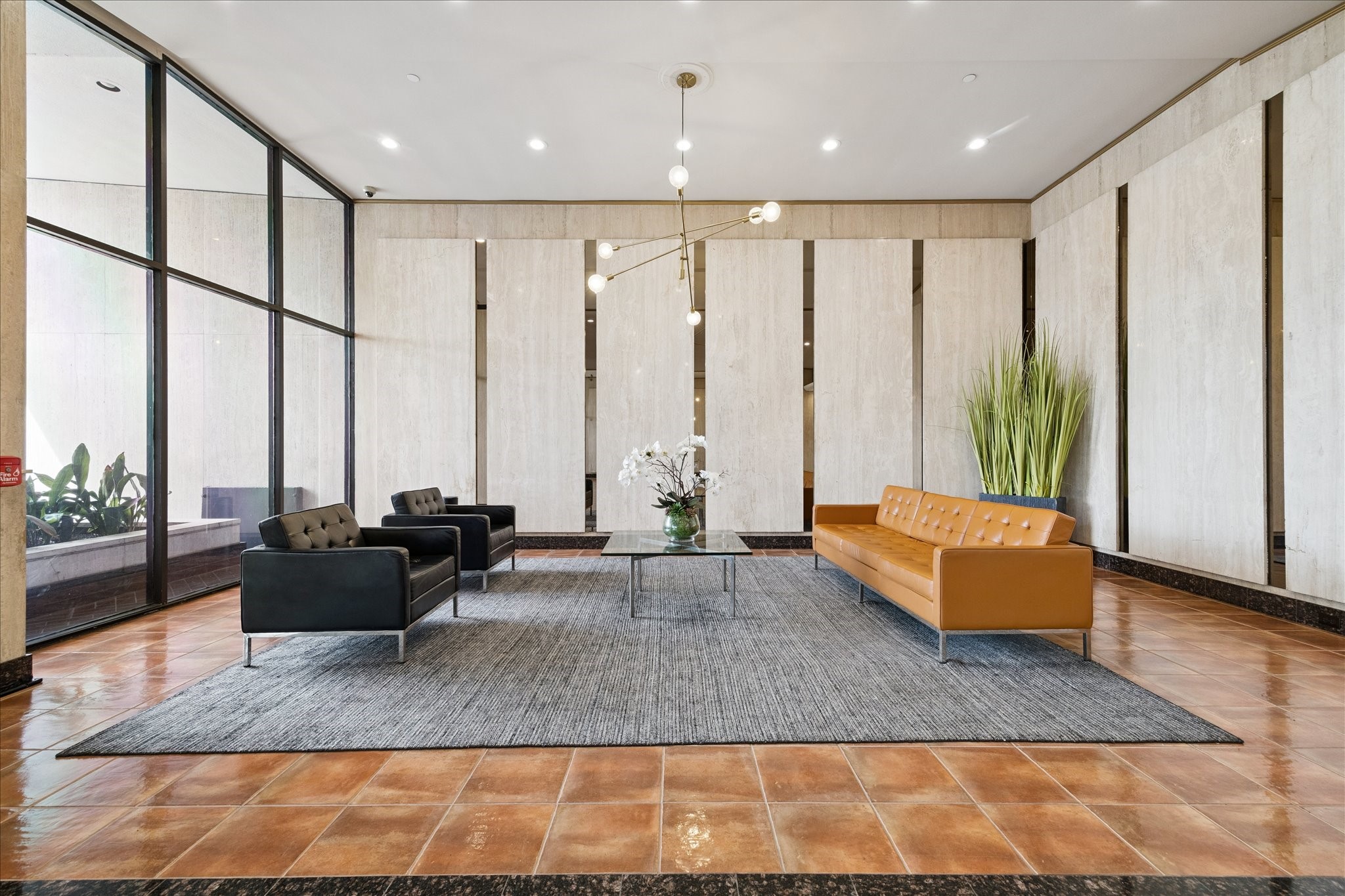 2016 Main Street, Unit 2417 Houston, TX 77002 - Photo 16 of 40 a living room with furniture and large windows