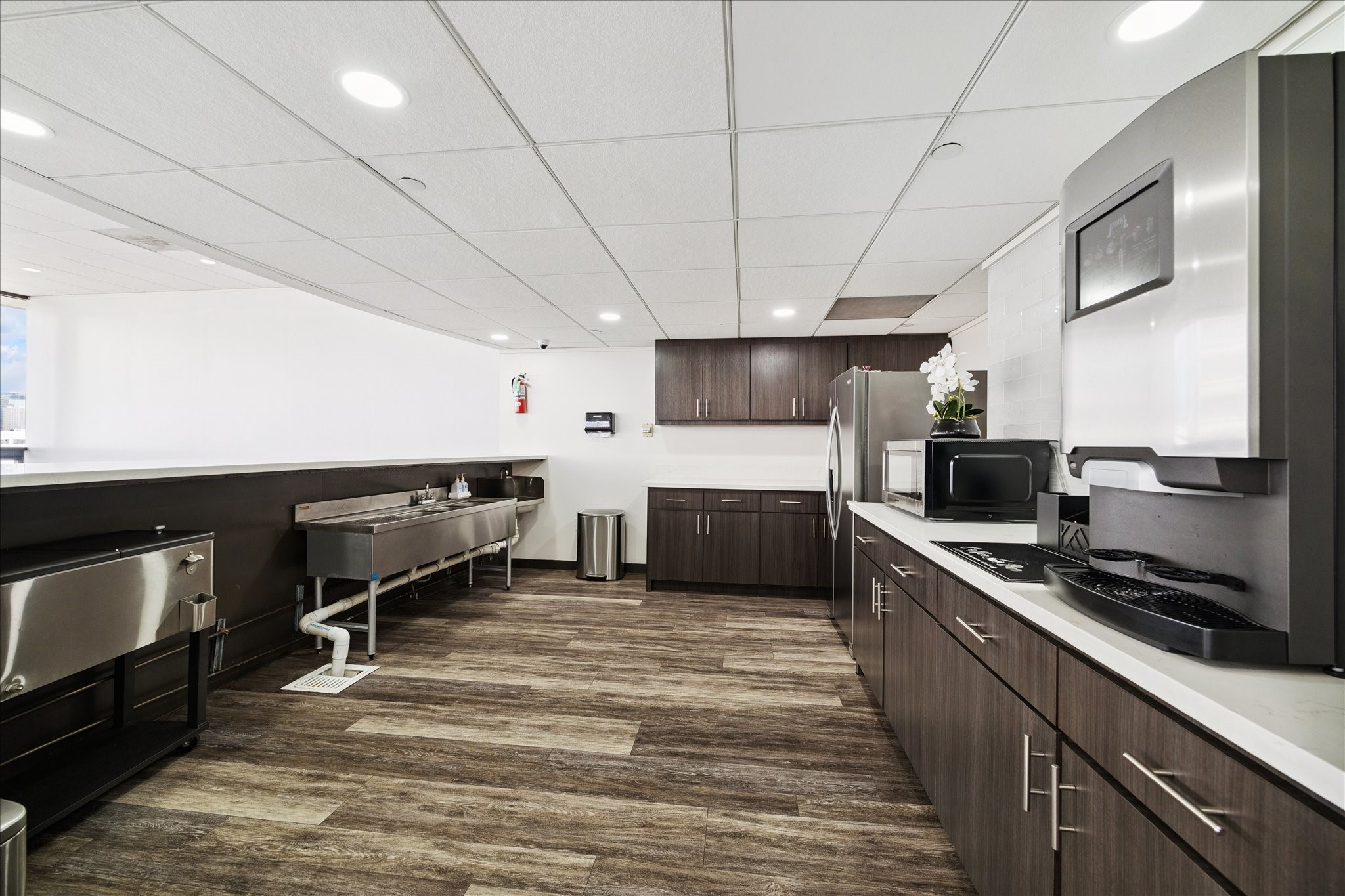 2016 Main Street, Unit 2417 Houston, TX 77002 - Photo 26 of 40 a kitchen with stainless steel appliances a stove sink and cabinets