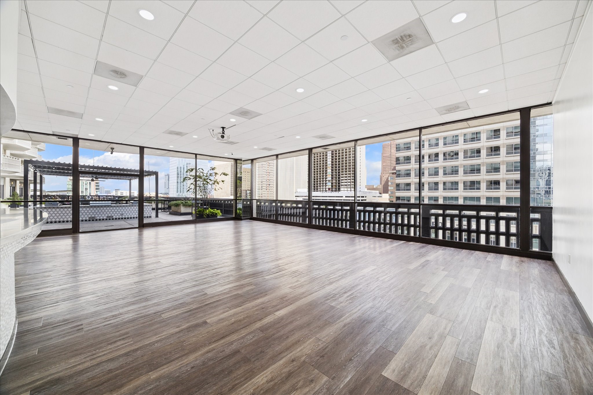 2016 Main Street, Unit 2417 Houston, TX 77002 - Photo 28 of 40 a view of a room with lots of wooden floor