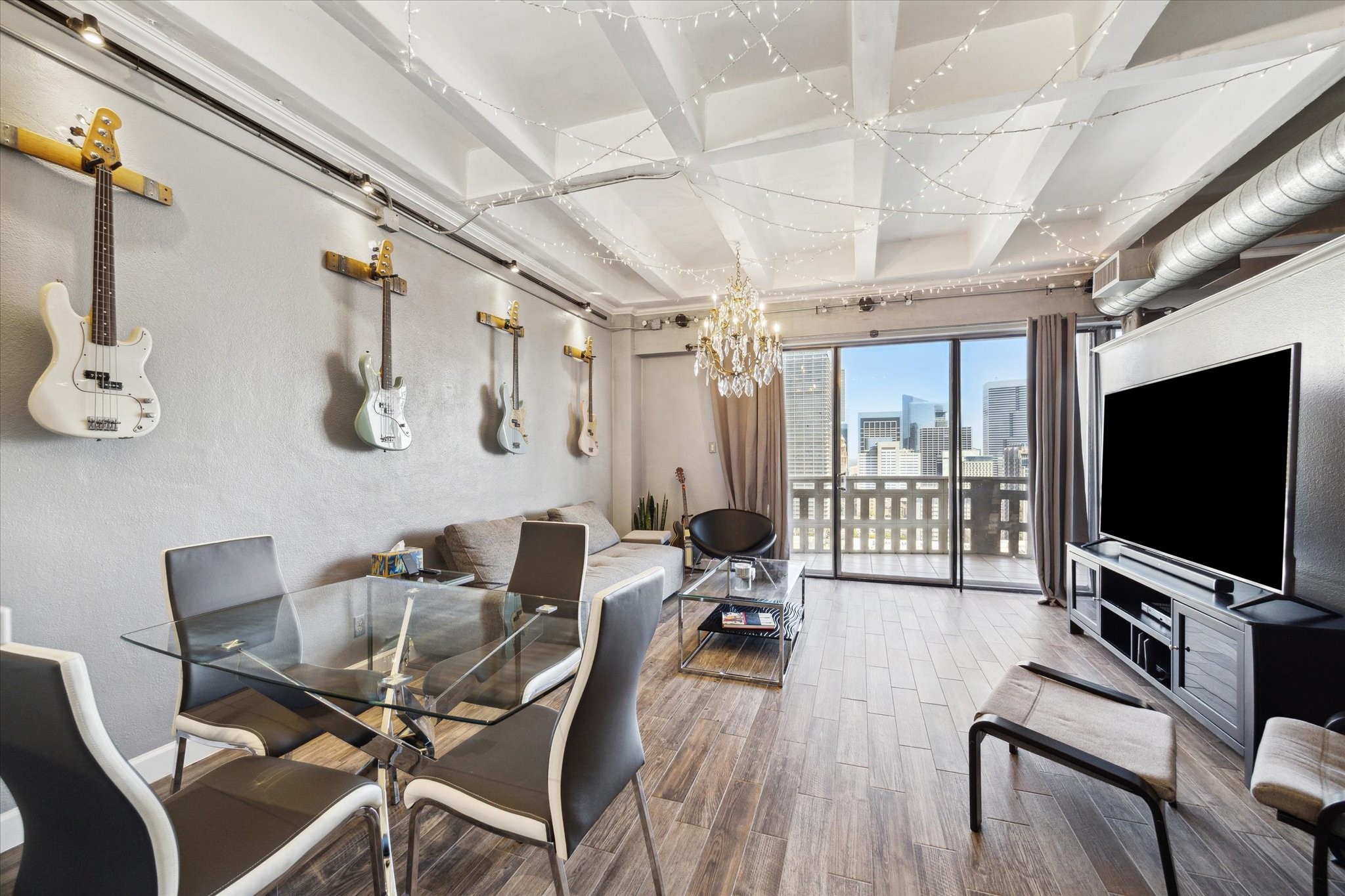 2016 Main Street, Unit 2417 Houston, TX 77002 - Photo 3 of 40 a living room with furniture and a flat screen tv