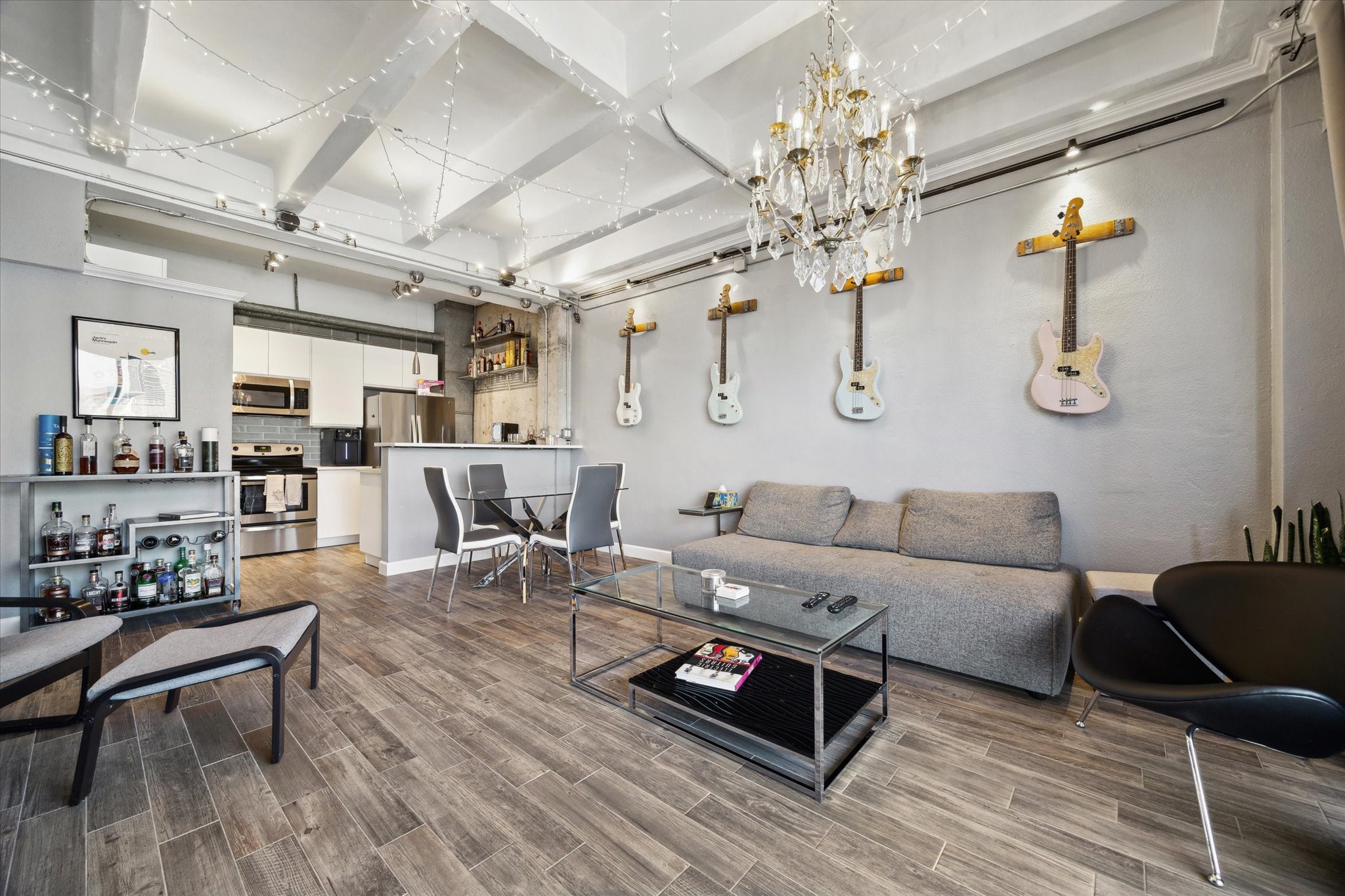 2016 Main Street, Unit 2417 Houston, TX 77002 - Photo 4 of 40 a living room with furniture and a chandelier
