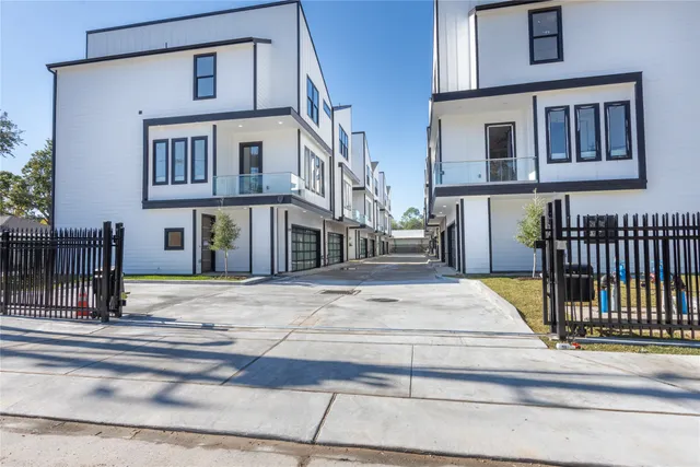 a view of a brick building next to a road
