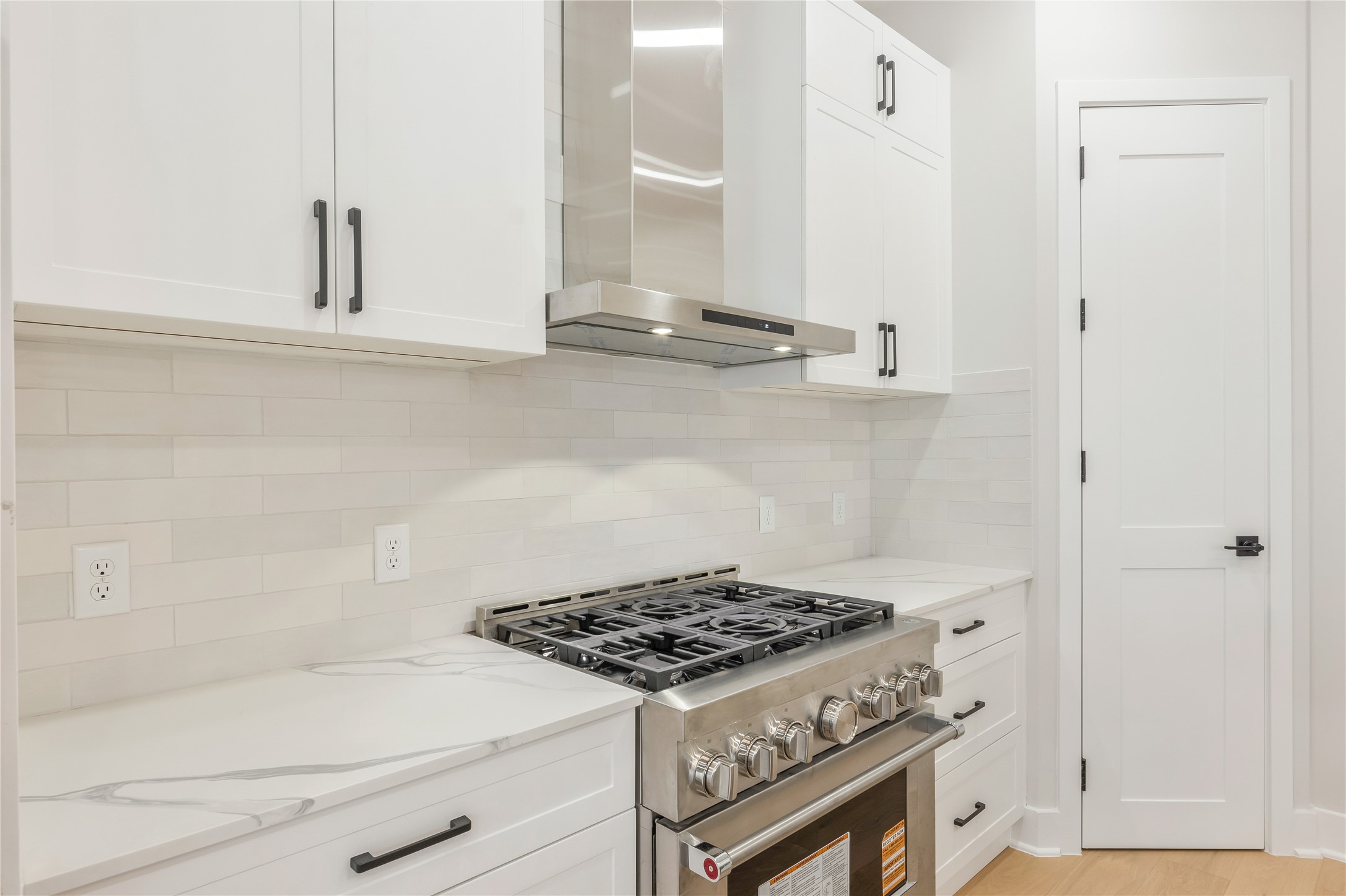 2239 Blalock Road Houston, TX 77080 - Photo 11 of 33 a stove top oven sitting inside of a kitchen