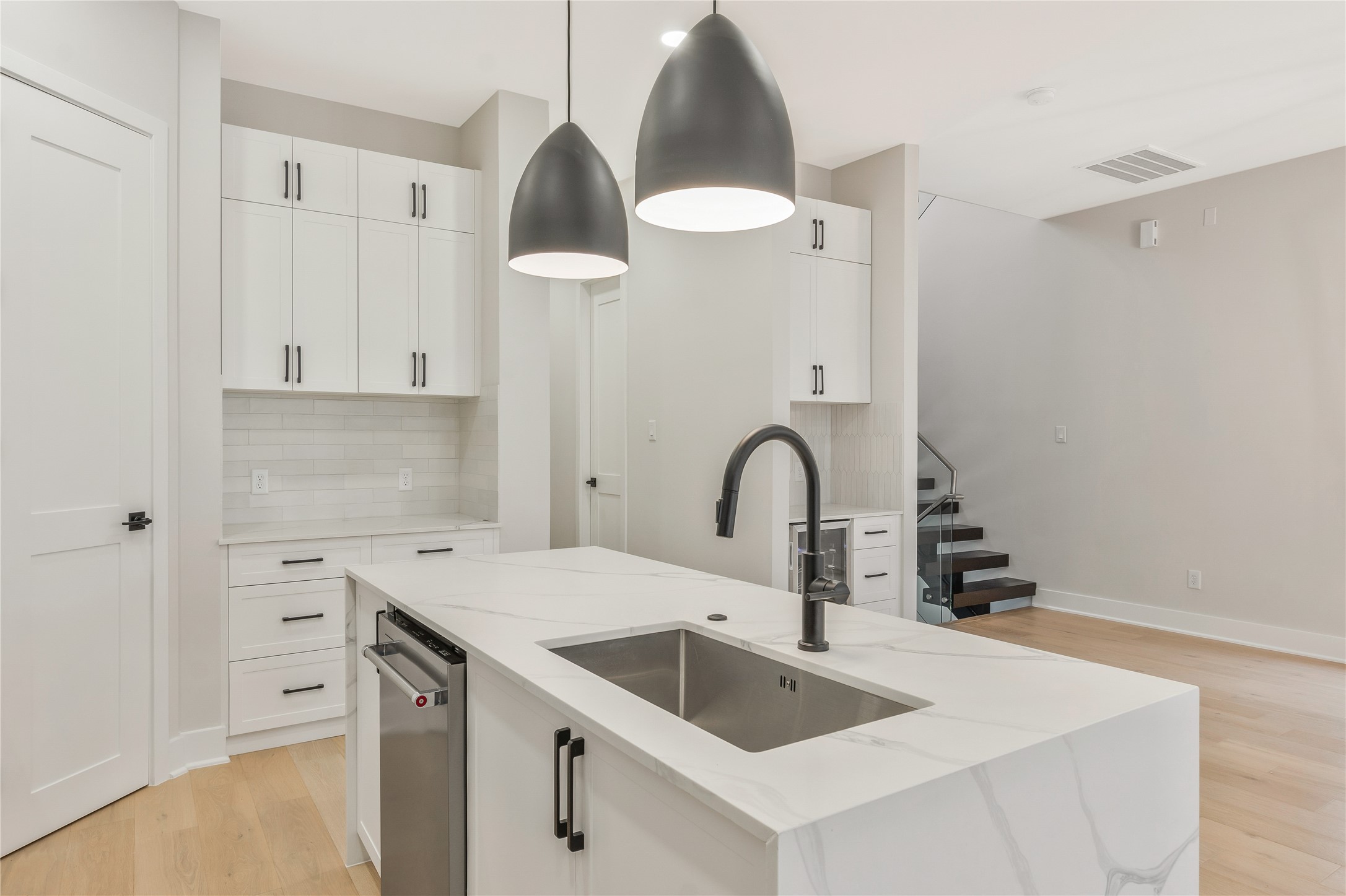 2239 Blalock Road Houston, TX 77080 - Photo 12 of 33 a kitchen with granite countertop a sink a stove and cabinets