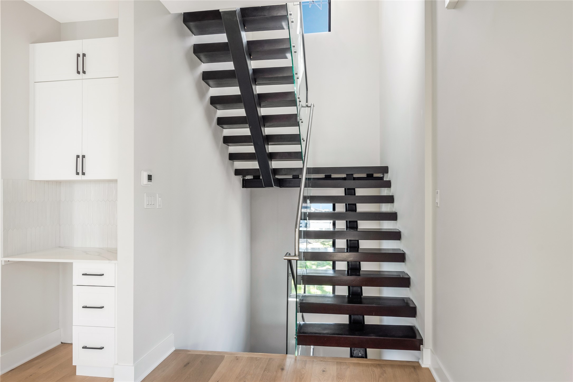 2239 Blalock Road Houston, TX 77080 - Photo 17 of 33 a view of closet with wooden floor