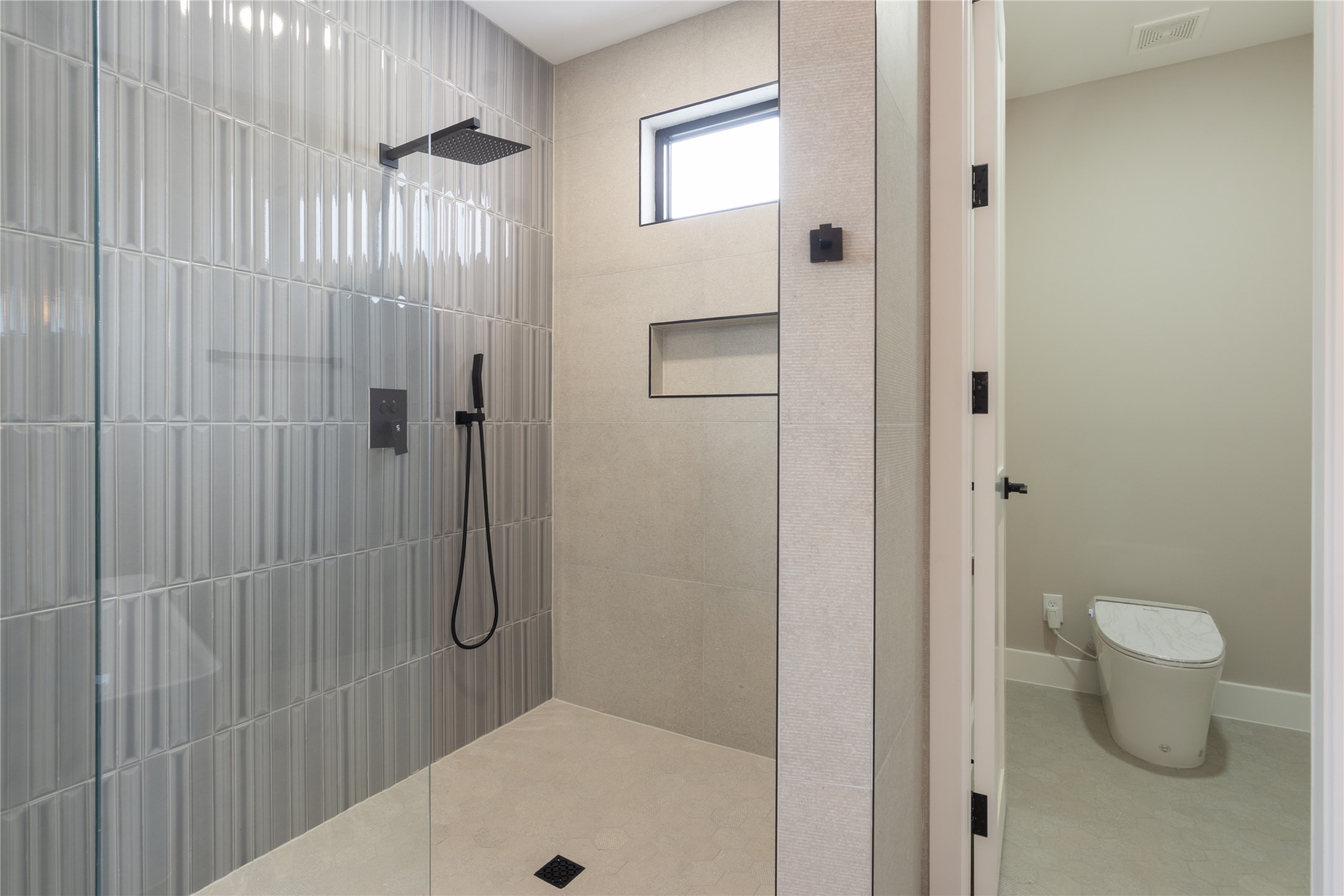 2239 Blalock Road Houston, TX 77080 - Photo 26 of 33 a bathroom with a shower and a toilet