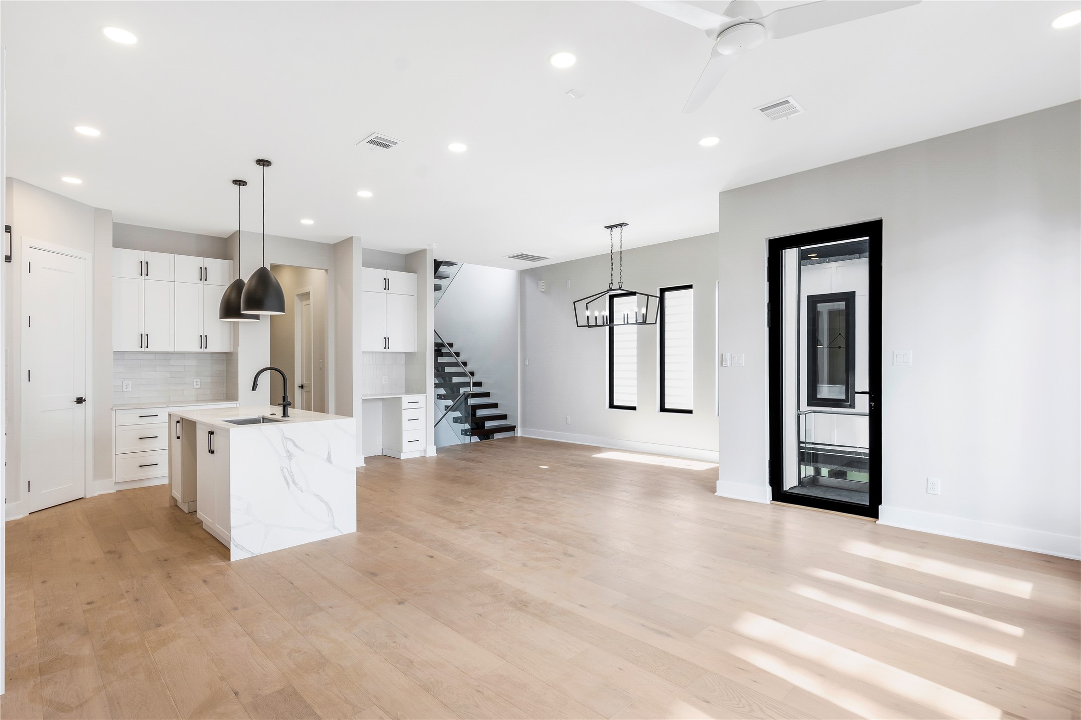 2239 Blalock Road Houston, TX 77080 - Photo 9 of 33 a large white kitchen with a refrigerator a stove and a sink