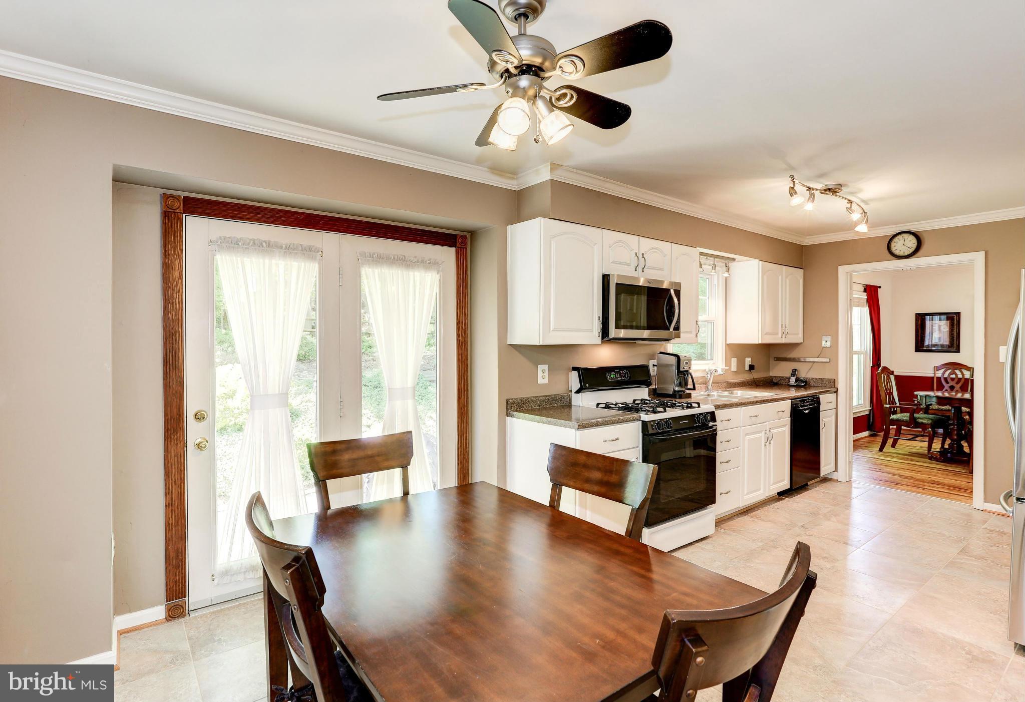 7024 Flax Street Springfield, VA 22152 - Photo 11 of 30 BREAKFAST AREA WITH ATRIUM DOOR TO PATIO