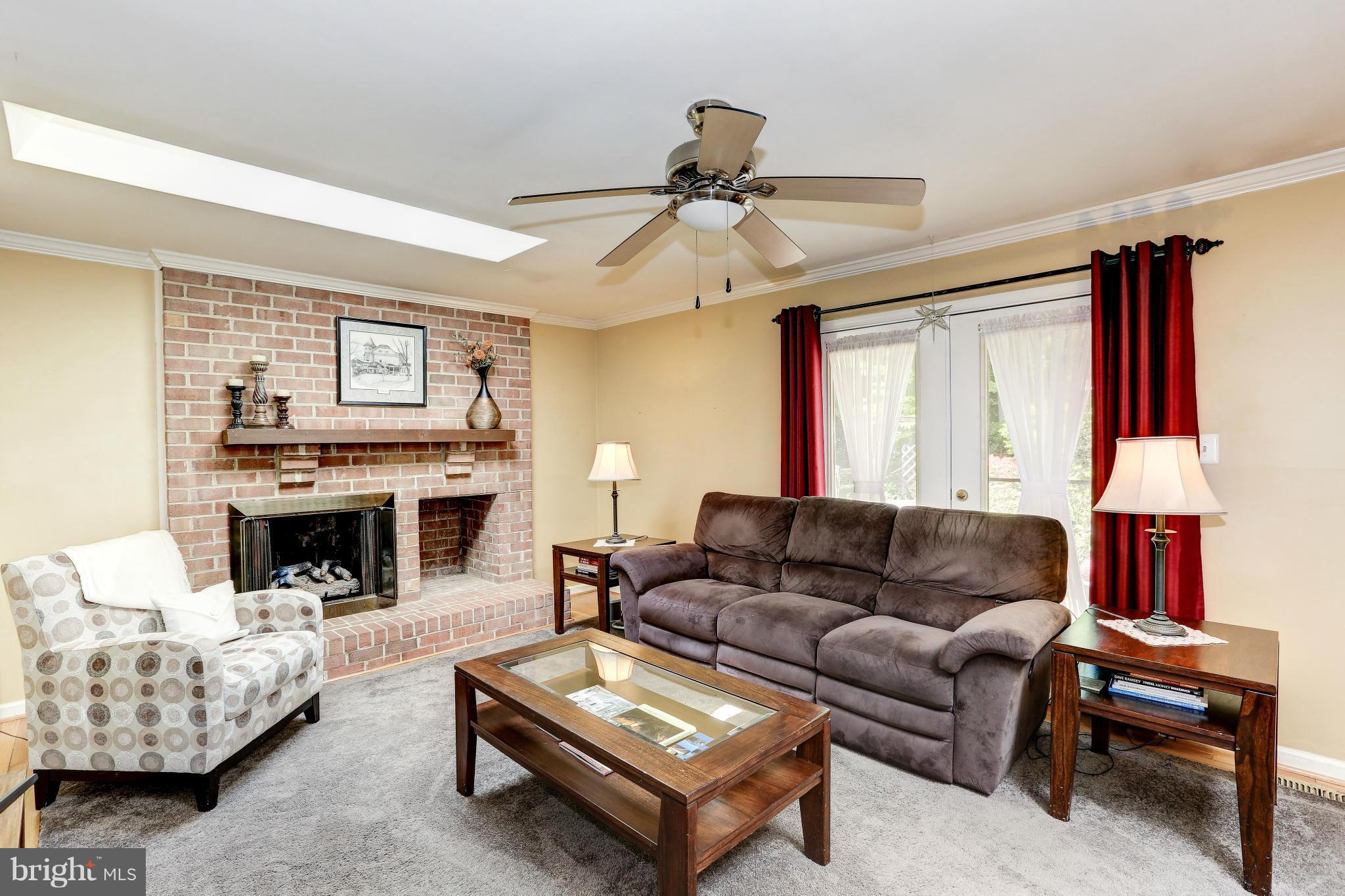 7024 Flax Street Springfield, VA 22152 - Photo 12 of 30 FAMILY ROOM WITH WOOD BURNING FPL AND GAS LOGS