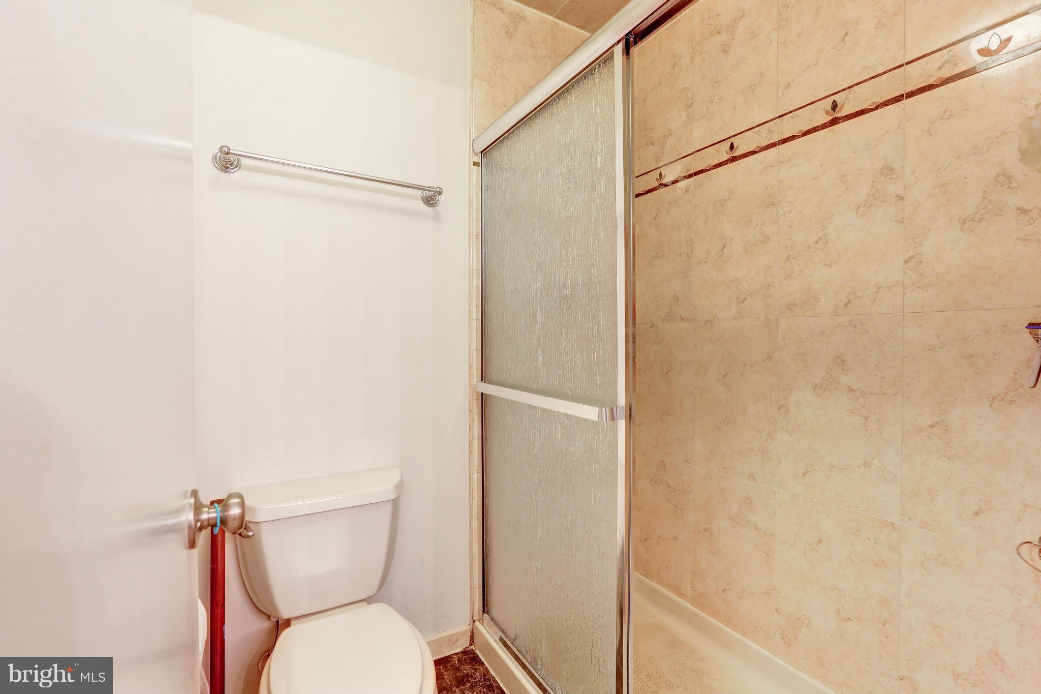 7024 Flax Street Springfield, VA 22152 - Photo 19 of 30 UPDATED SHOWER AND COMMODE AREA