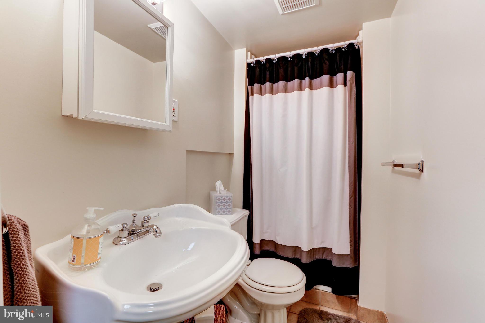 7024 Flax Street Springfield, VA 22152 - Photo 26 of 30 FULL LOWER LEVEL BATH WITH PEDESTAL SINK