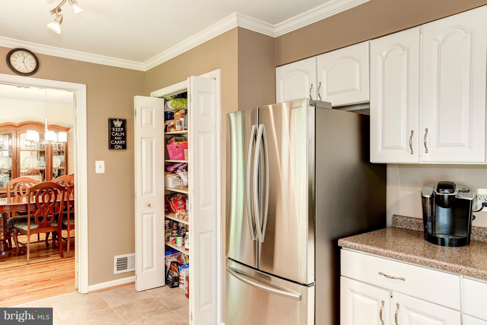 7024 Flax Street Springfield, VA 22152 - Photo 6 of 30 PANTRY CLOSET TO LEFT AND NEW SS FRIDGE