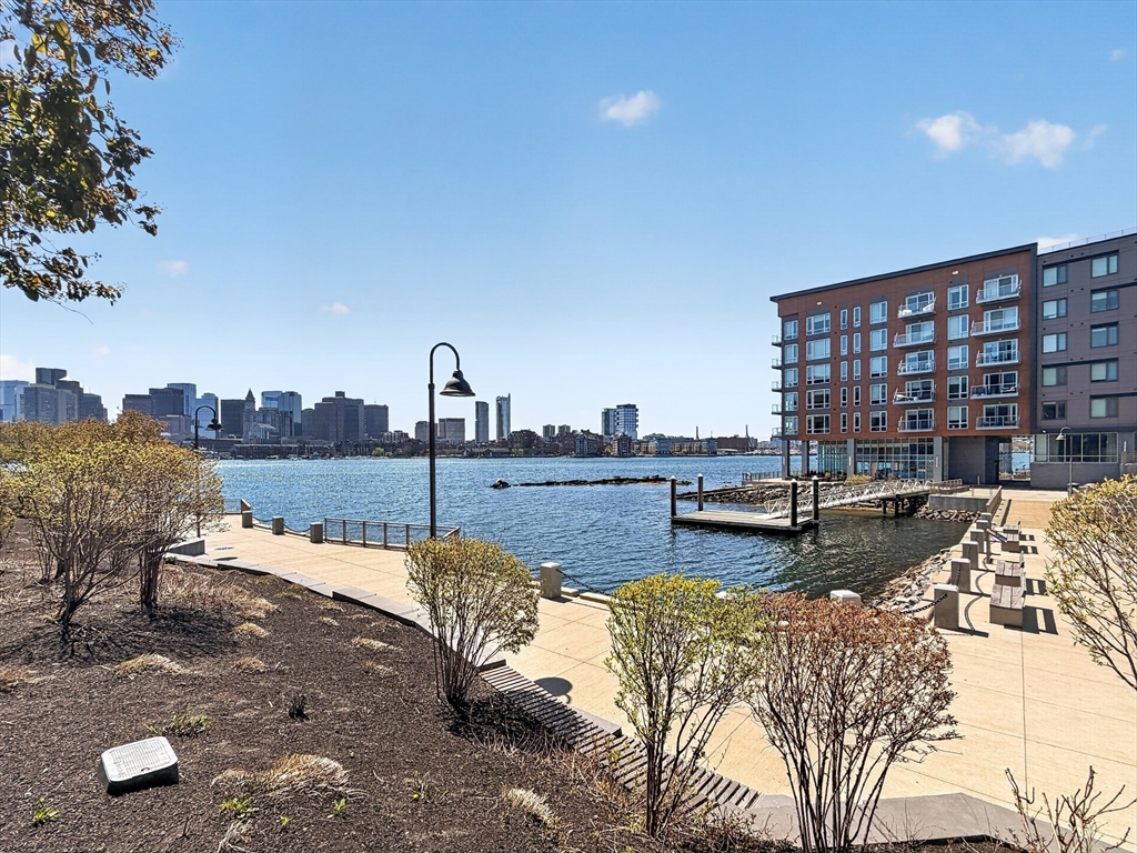 45 Lewis Street, Unit 316 Boston, MA 02128 - Photo 31 of 32 a view of swimming pool with outdoor seating and city view