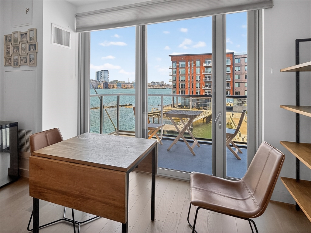 45 Lewis Street, Unit 316 Boston, MA 02128 - Photo 4 of 32 a view of a dining room with furniture window and outside view