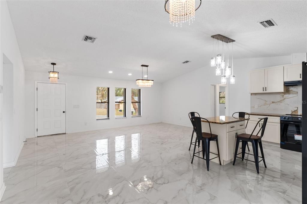 6096 East Tremont Street Inverness, FL 34452 - Photo 13 of 47 a view of a dining room with furniture