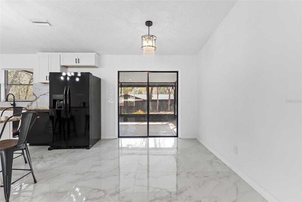 6096 East Tremont Street Inverness, FL 34452 - Photo 18 of 47 a view of a hallway with wooden floor and windows