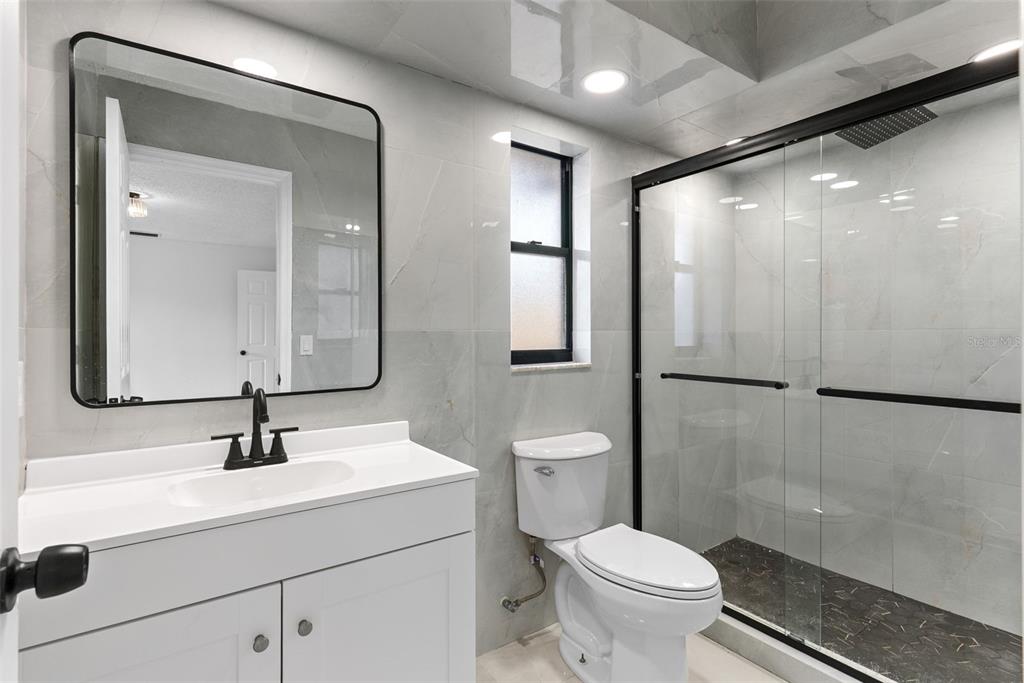 6096 East Tremont Street Inverness, FL 34452 - Photo 23 of 47 a bathroom with a sink toilet and shower