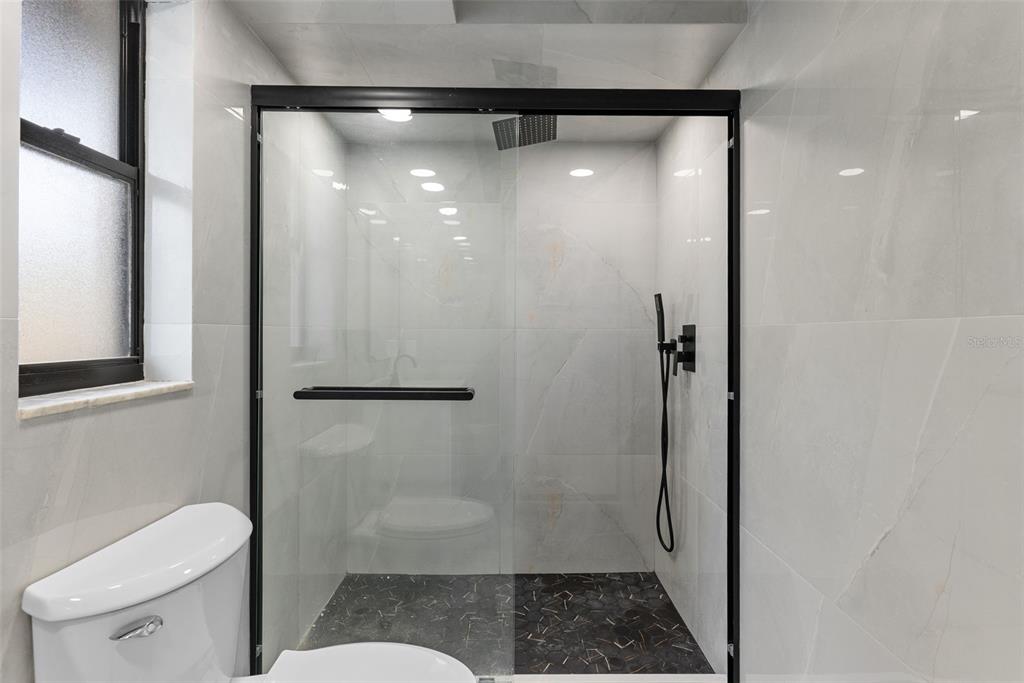 6096 East Tremont Street Inverness, FL 34452 - Photo 24 of 47 a bathroom with a shower and a toilet