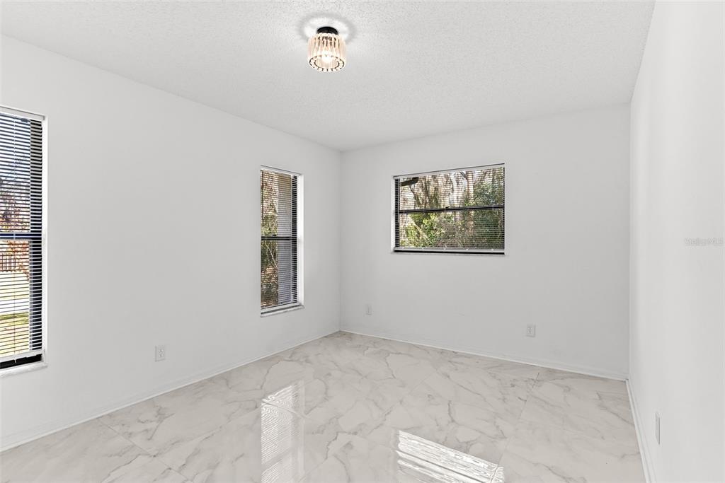 6096 East Tremont Street Inverness, FL 34452 - Photo 26 of 47 an empty room with windows and closet