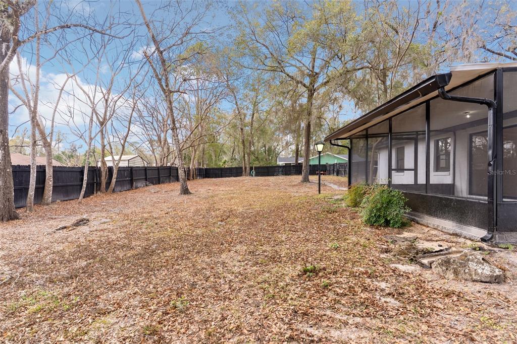 6096 East Tremont Street Inverness, FL 34452 - Photo 34 of 47 a view of a house with a yard