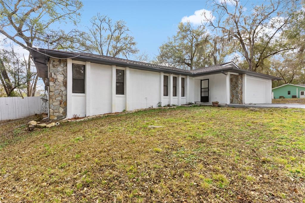 6096 East Tremont Street Inverness, FL 34452 - Photo 6 of 47 a view of a house with a yard