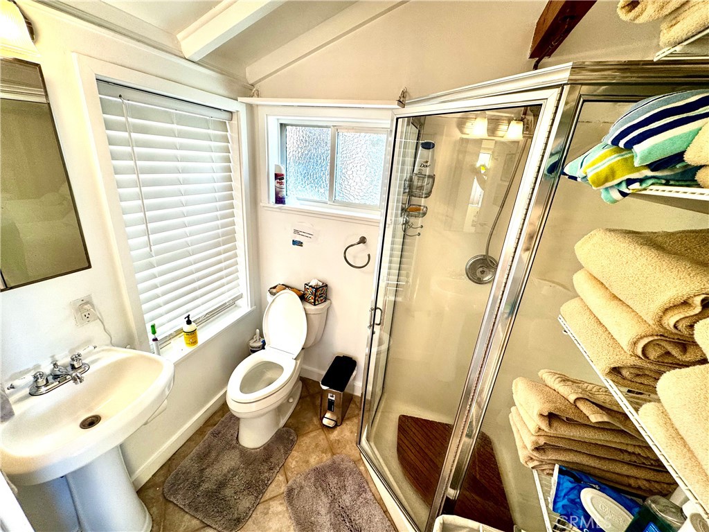 455 Myrtle Street Laguna Beach, CA 92651 - Photo 4 of 9 a bathroom with a sink and toilet