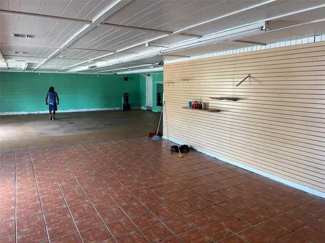 a view of a backyard with a garage