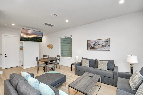 a living room with furniture and a large window