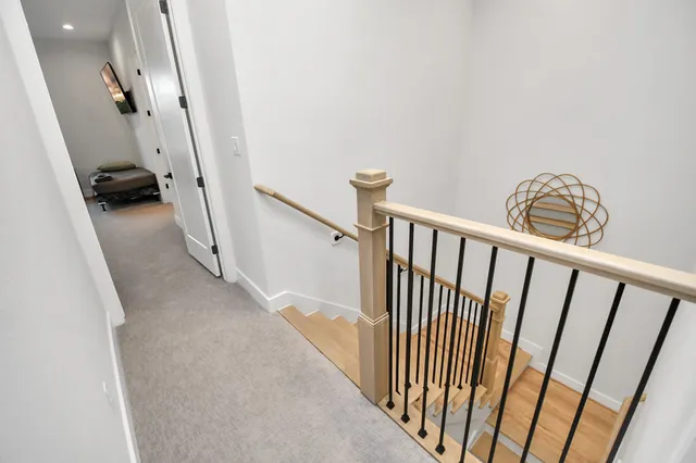 a view of a hallway with a car parked in living room