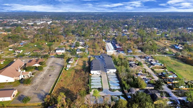 an aerial view of residential houses with outdoor space