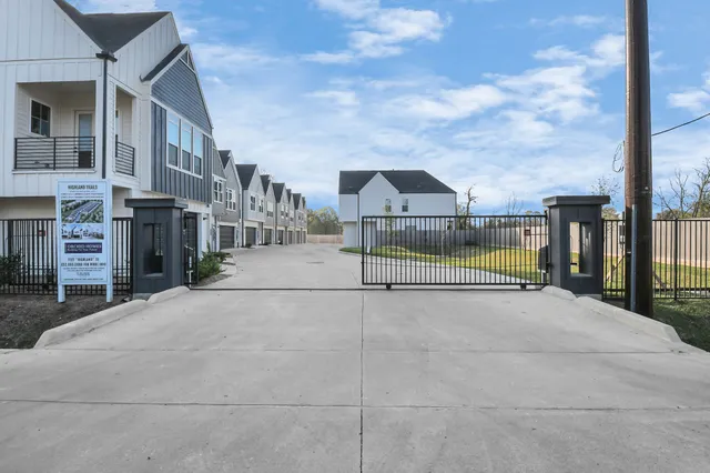 a view of a street with houses