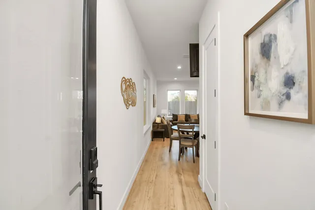 a view of a living room with a wooden floor
