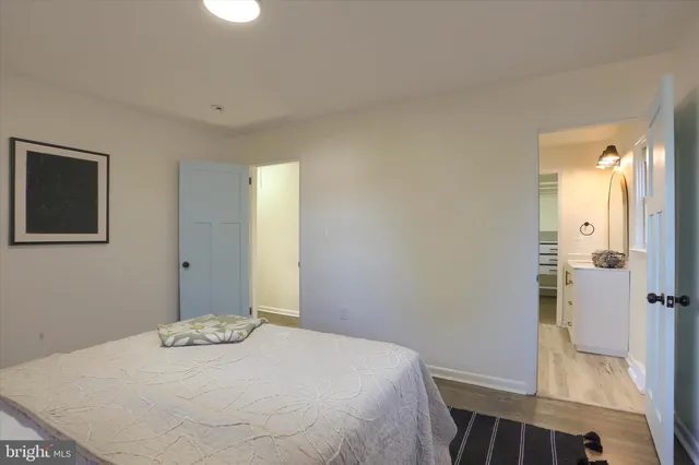 a bedroom with a bed and a view of bathroom