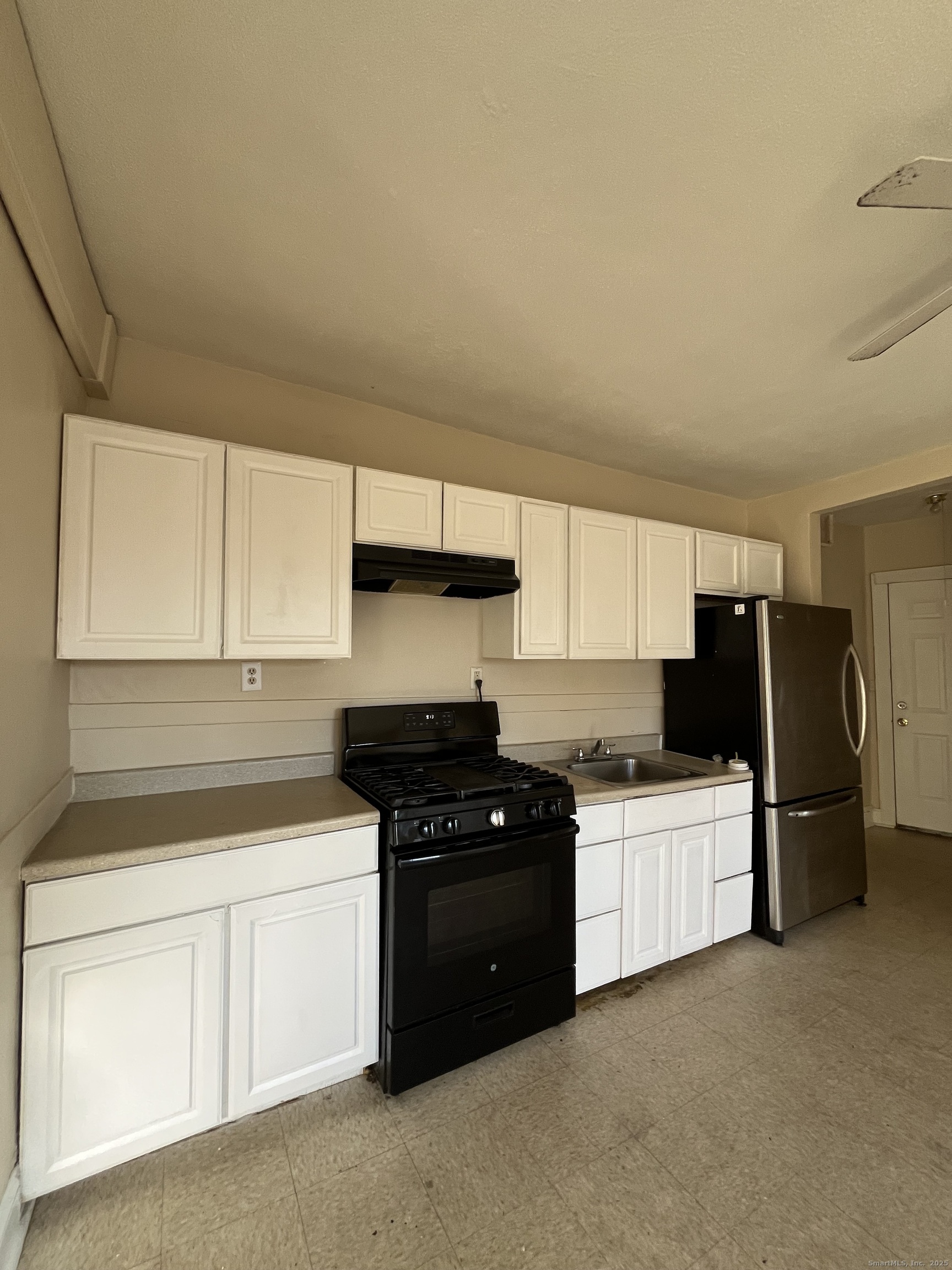 Undisclosed Address New Britain, CT 06051 - Photo 1 of 8 a kitchen with stainless steel appliances a refrigerator a sink and white cabinets
