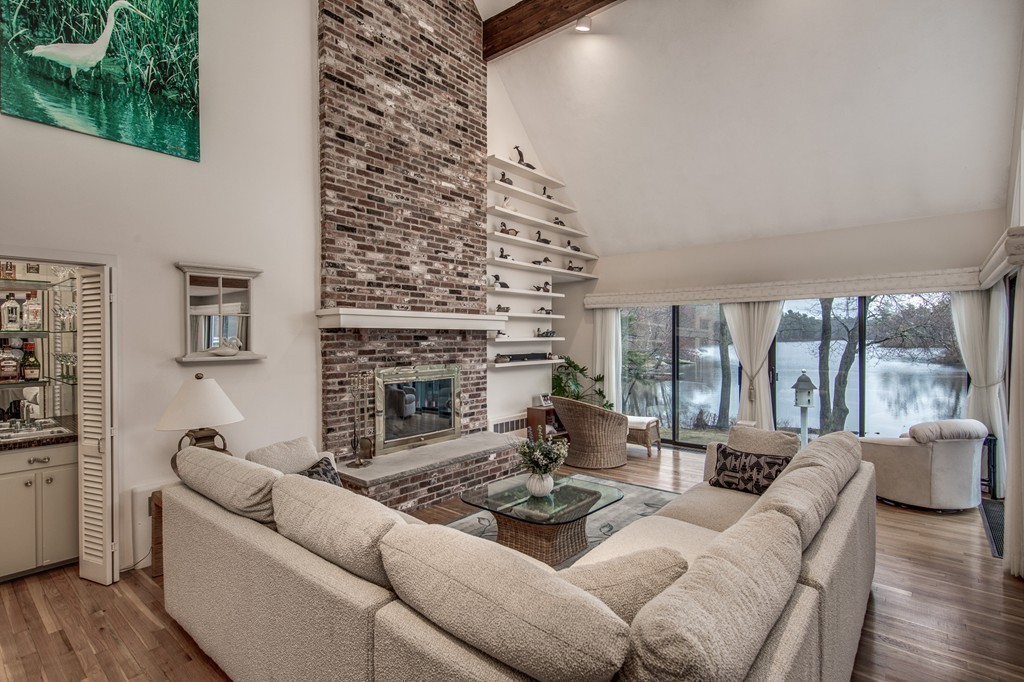 9 Beaver Pond Road Beverly, MA 01915 - Photo 4 of 21 a living room with furniture large window and a fireplace