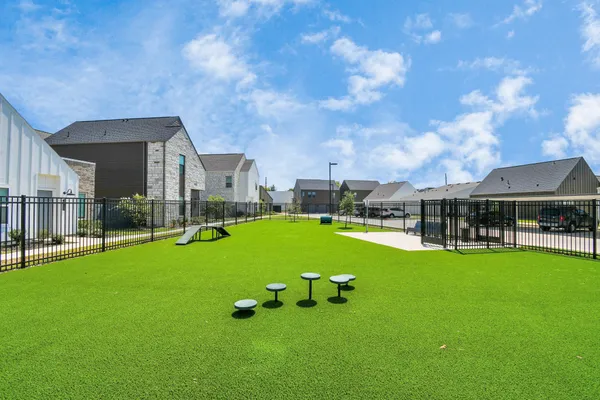 a view of yard with swimming pool and table and chairs