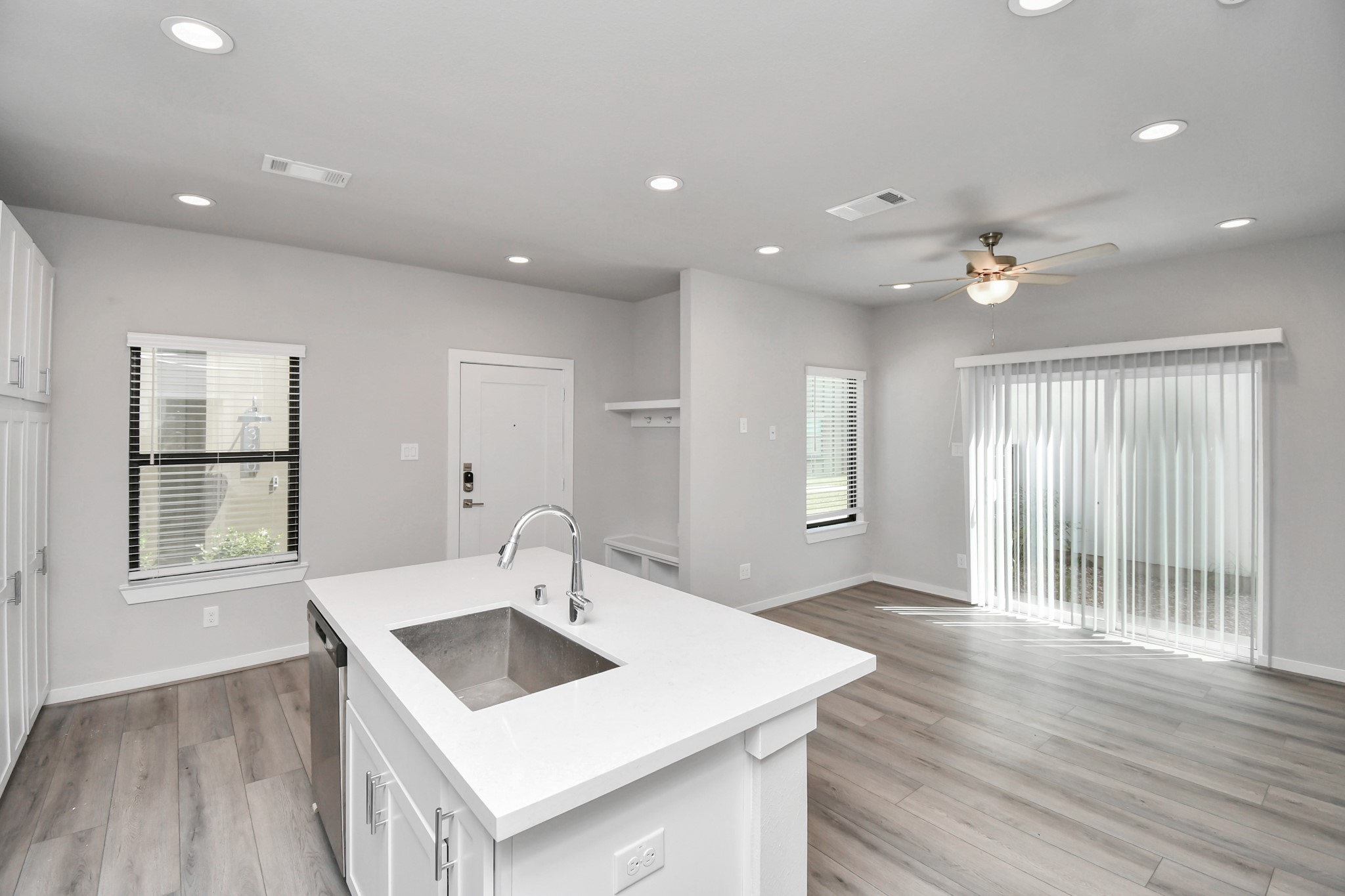 23823 Cumberland Ridge Drive, Unit 621 Hockley, TX 77447 - Photo 8 of 29 a view of kitchen island a sink wooden floor and a refrigerator